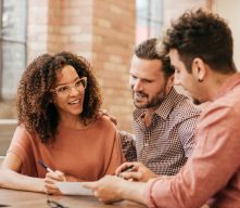 Couple Meeting Lender Going Over Application