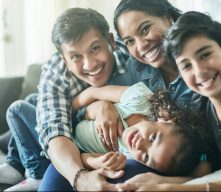 Happy family on sofa at home