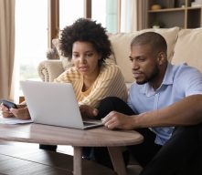African American Couple Looking at Computer