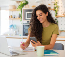 woman with calculator and computer