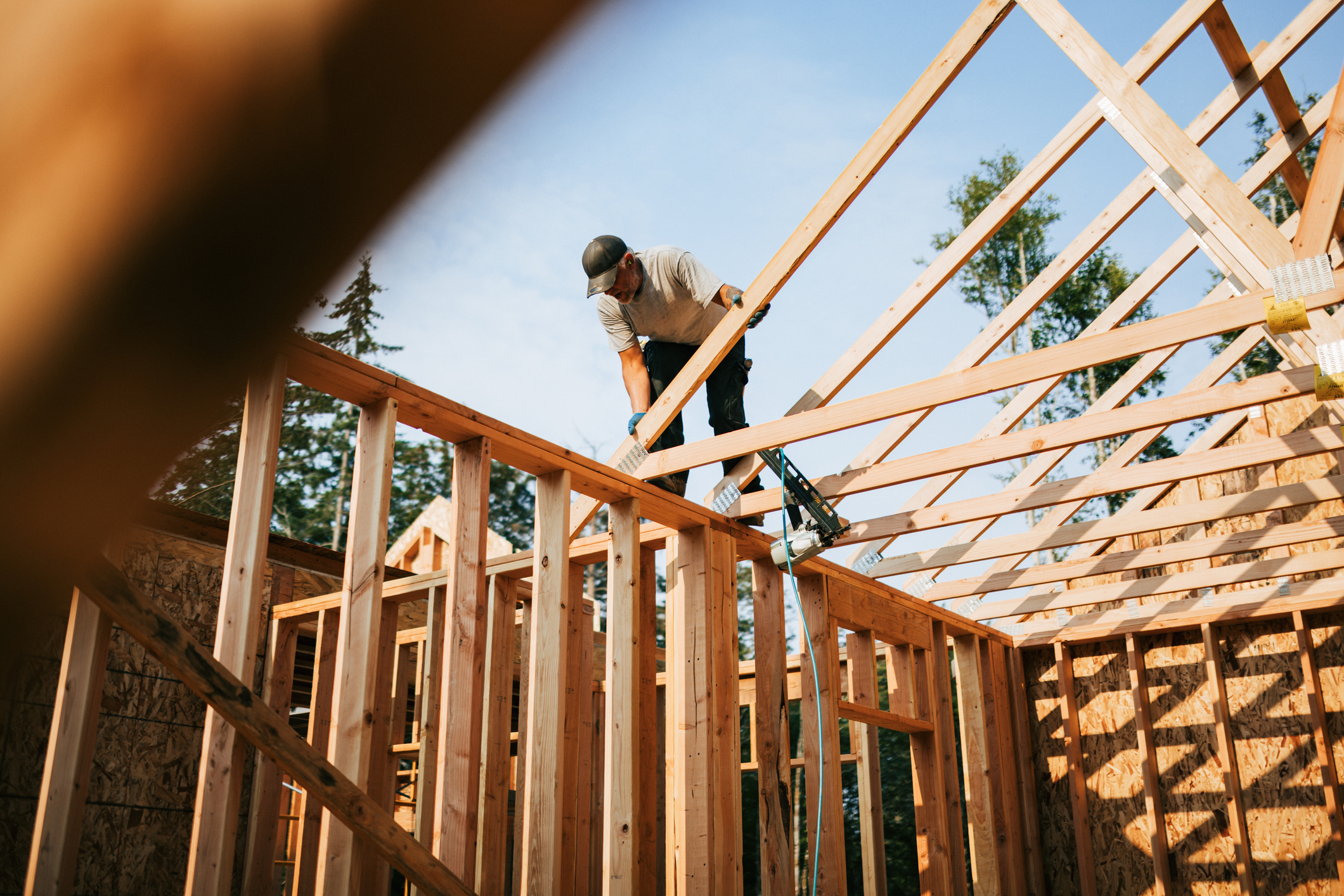 Construction worker putting framing up of a new home.